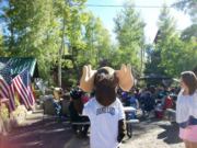 A thumb nail view of Grand Lake, Colorado during Constitution Week in September looking at Bruce the Grand Lake Moose standing at a Pegg Mann concert; click here to open a window with a larger picture.